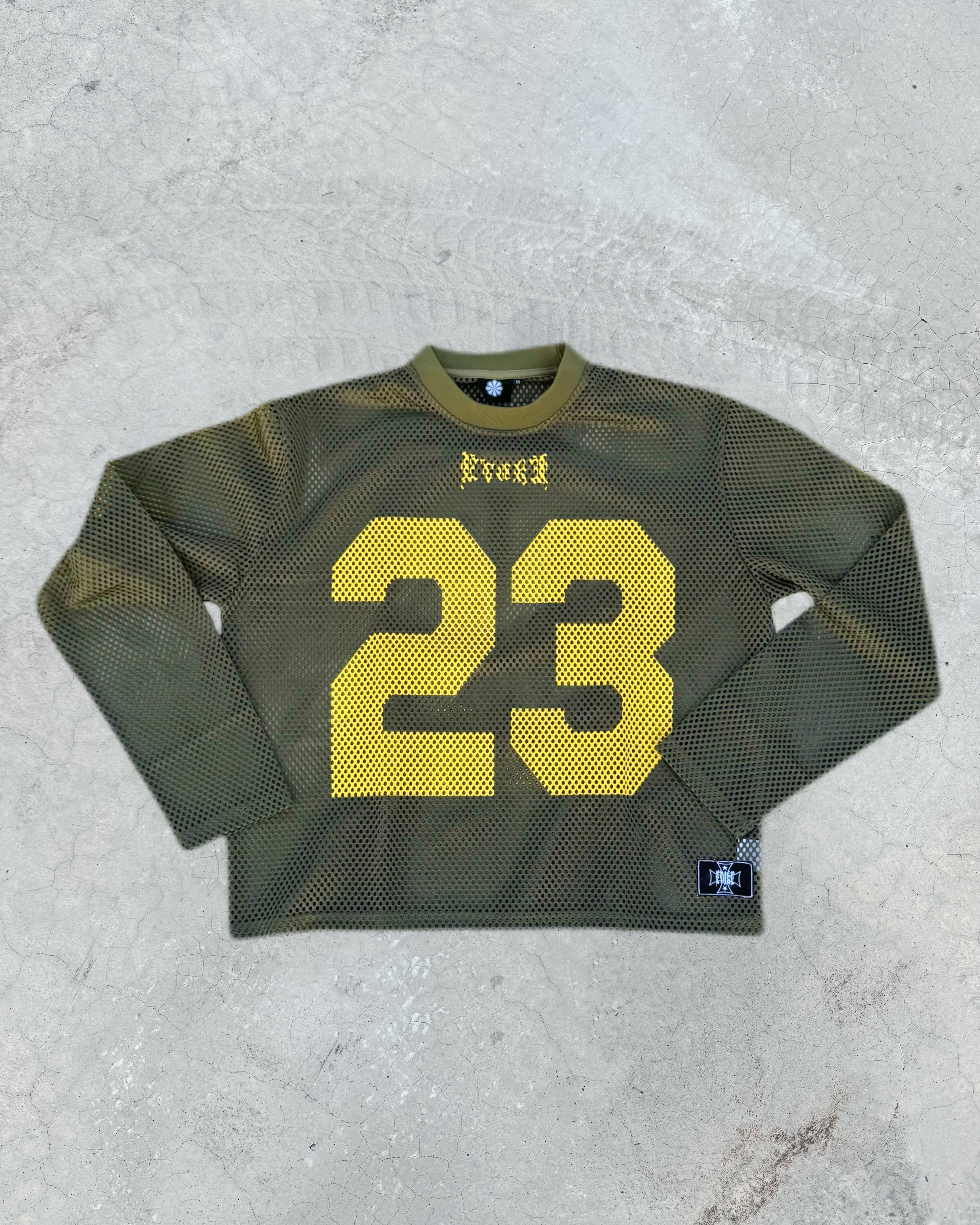 Green sports jersey with yellow number 23 on a textured gray background